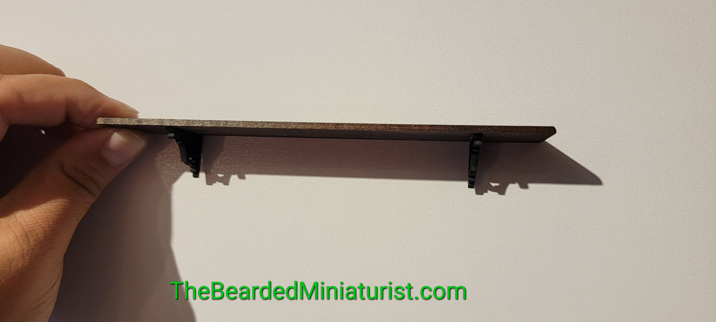 Wooden wall shelf with brackets.