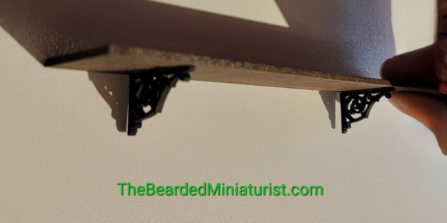 Wooden wall shelf with brackets.